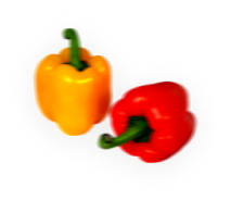 rev_home5_4.png Two bell peppers, one yellow and one red, with green stems, placed on a plain white background.